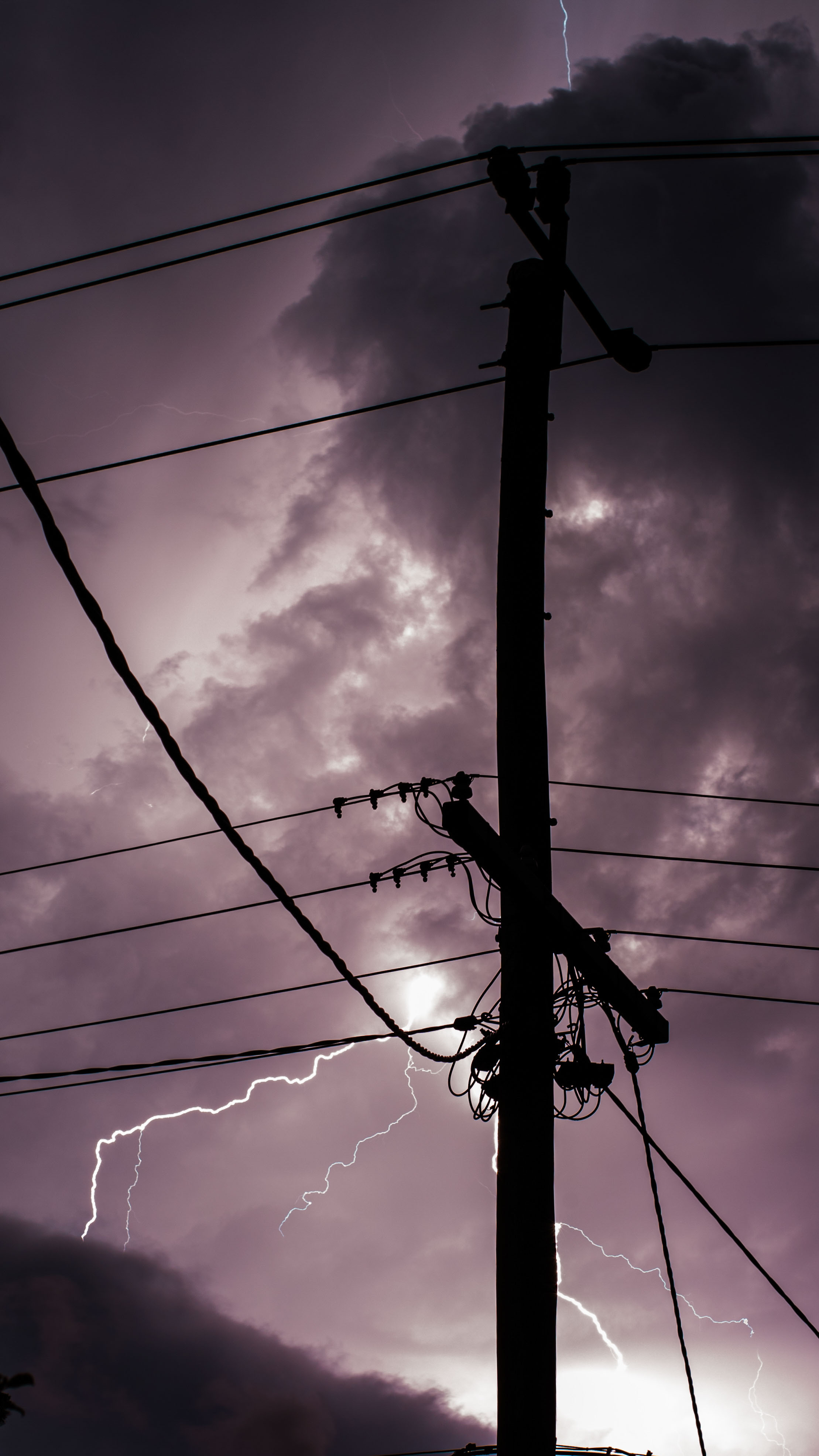 Lighting goes off behind power-pole